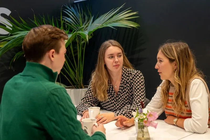 three individuals working 